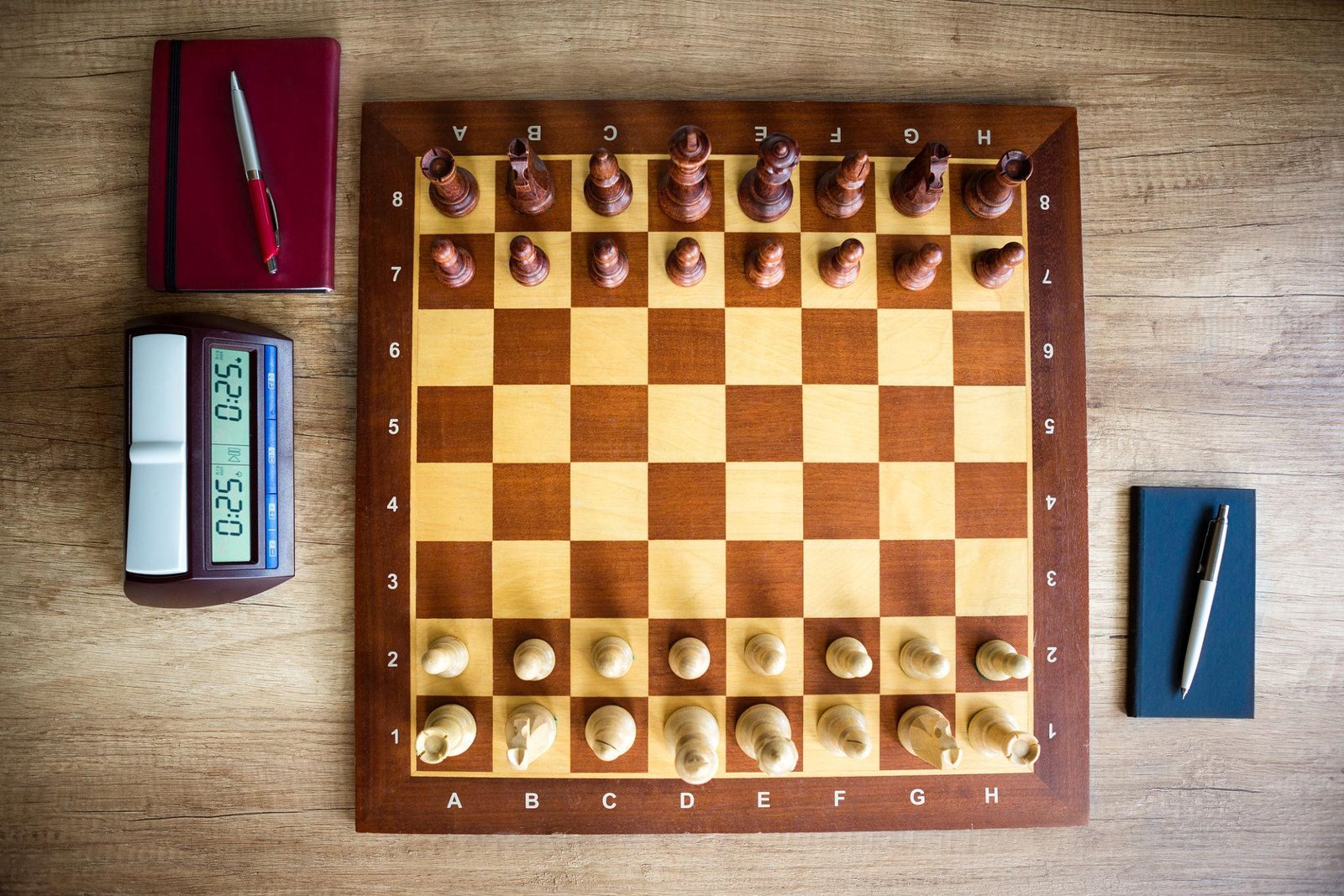 A detailed tournament day checklist alongside a chess clock, pen, and water bottle