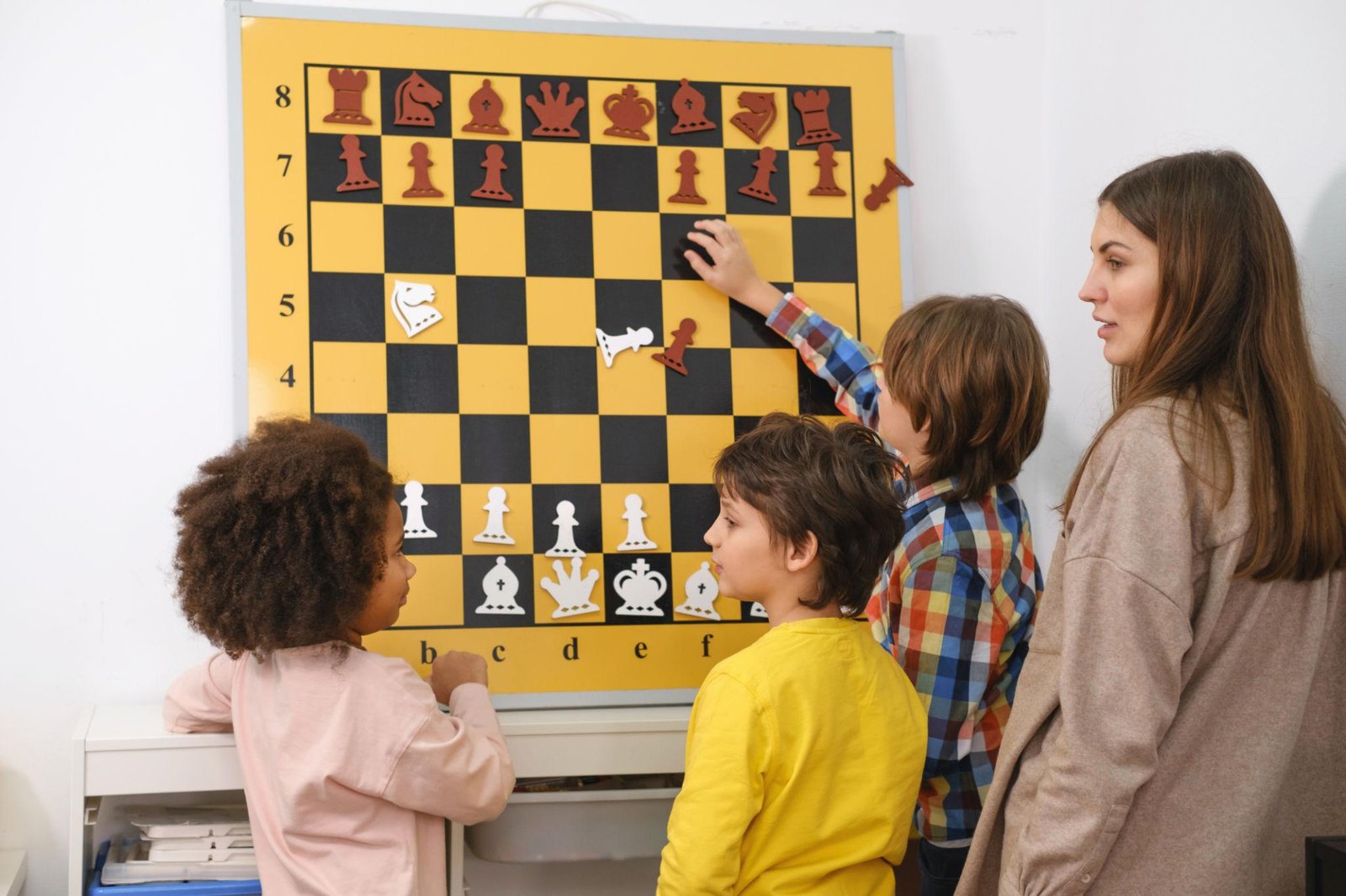 A young student enhancing cognitive skills through chess for child development by solving a tactical puzzle.