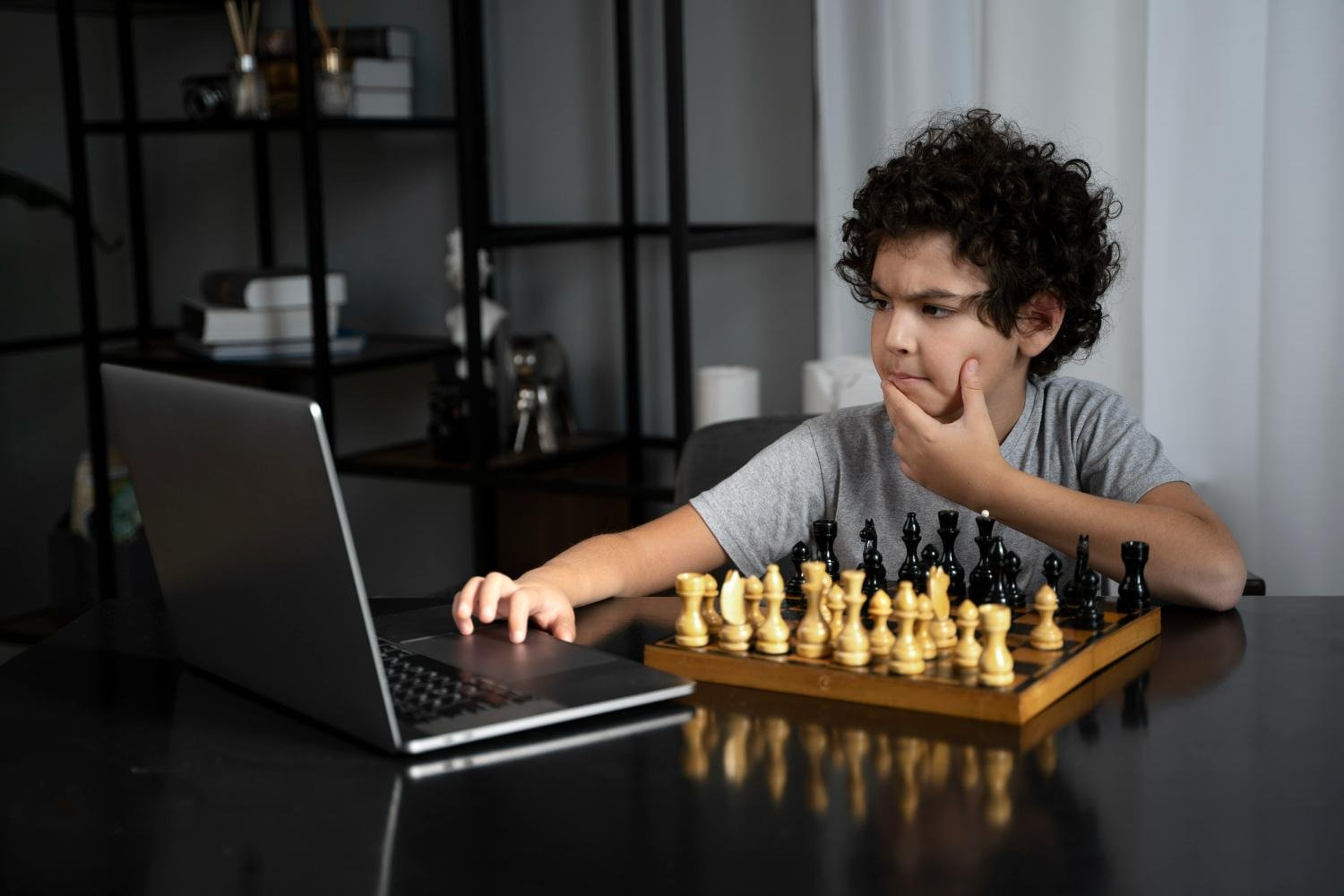 Dedicated student practicing daily tactical puzzles as part of their chess preparation guide