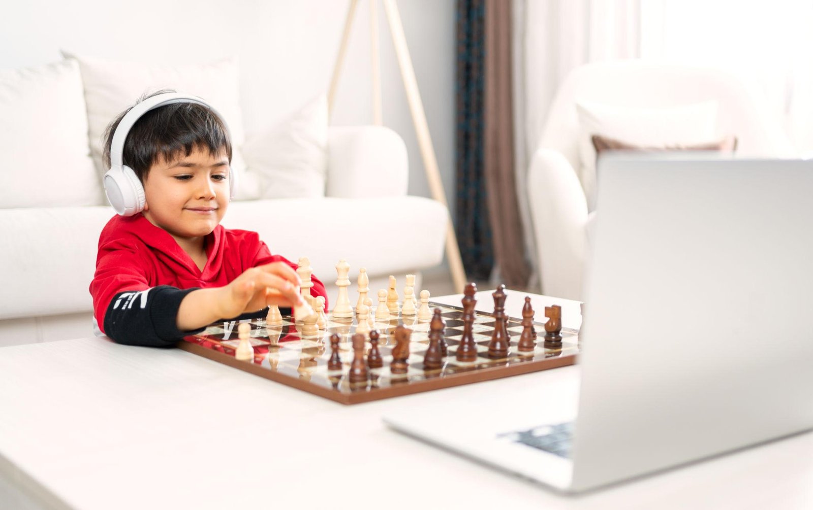 Student enjoying online chess coaching from home